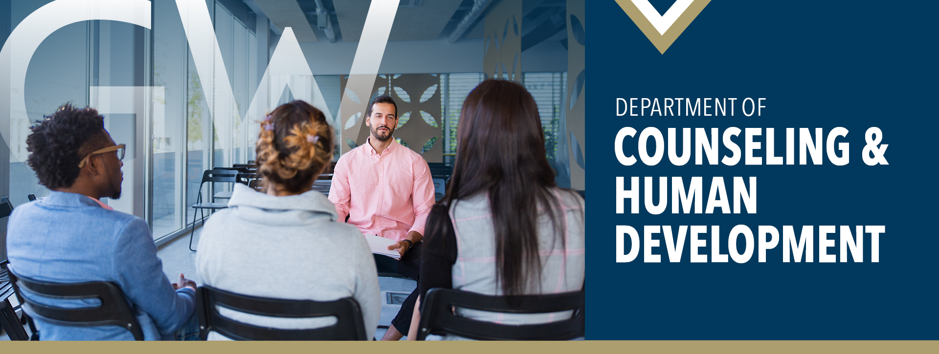Department of Counseling & Human Development (image of one male facing the camera talking to three people with their backs turned to camera)