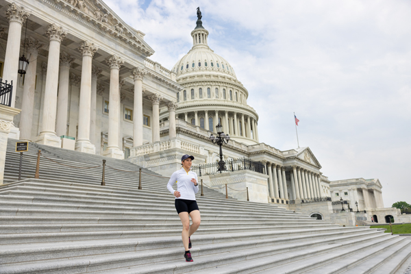 GSEHD student runs down the steps of the Capital Building