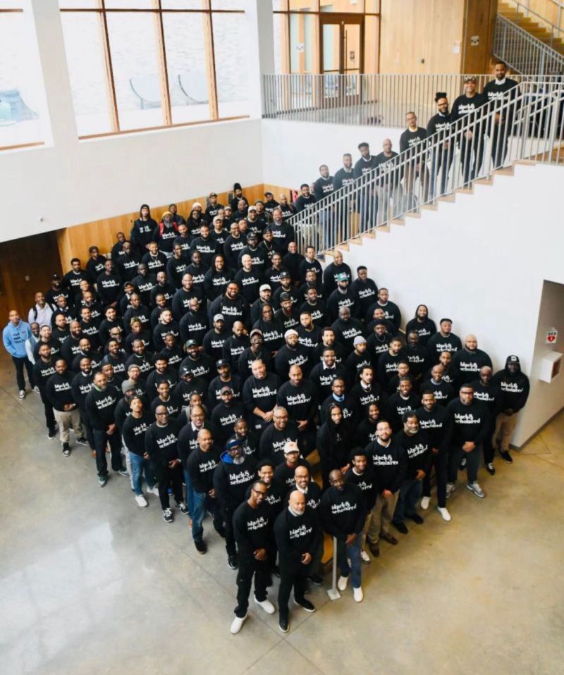 Attendees of the second annual Black Male Educators Convening pose for a group photo taken from above