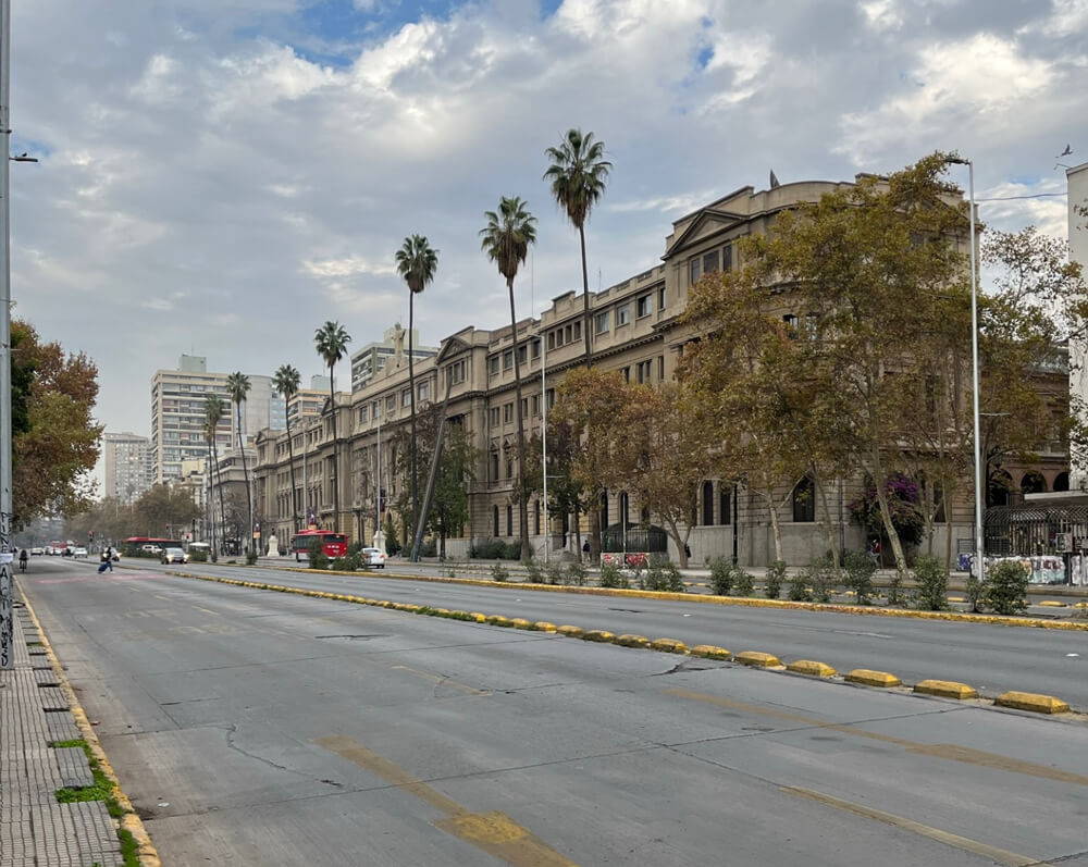 A rare sight of the city without traffic. Within this picture, we can see the European influences within the building architecture.