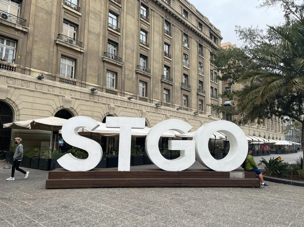 STGO sign with large standalone letters, short for Santiago de Chile, located in the center of downtown Santiago