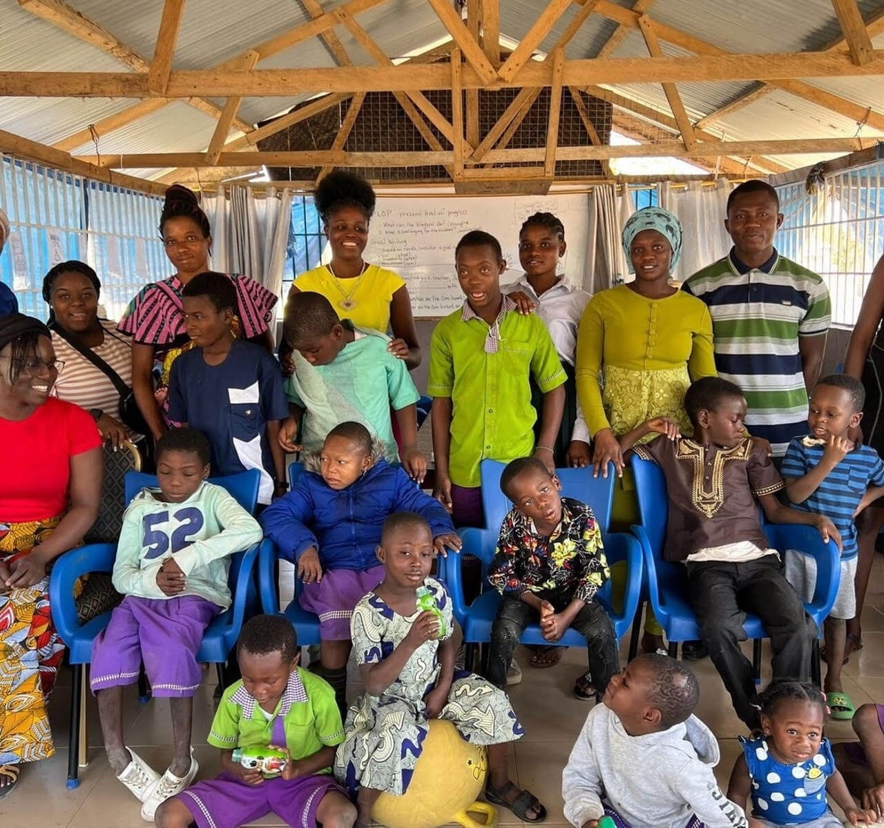 group photo of participants and their students at the International Inclusive Education Symposium