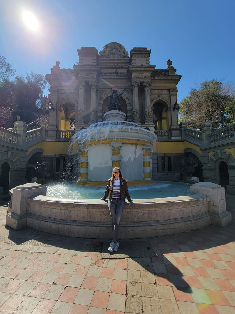 Caroline poses for photo in front of water feature at Cerro Santa Lucia