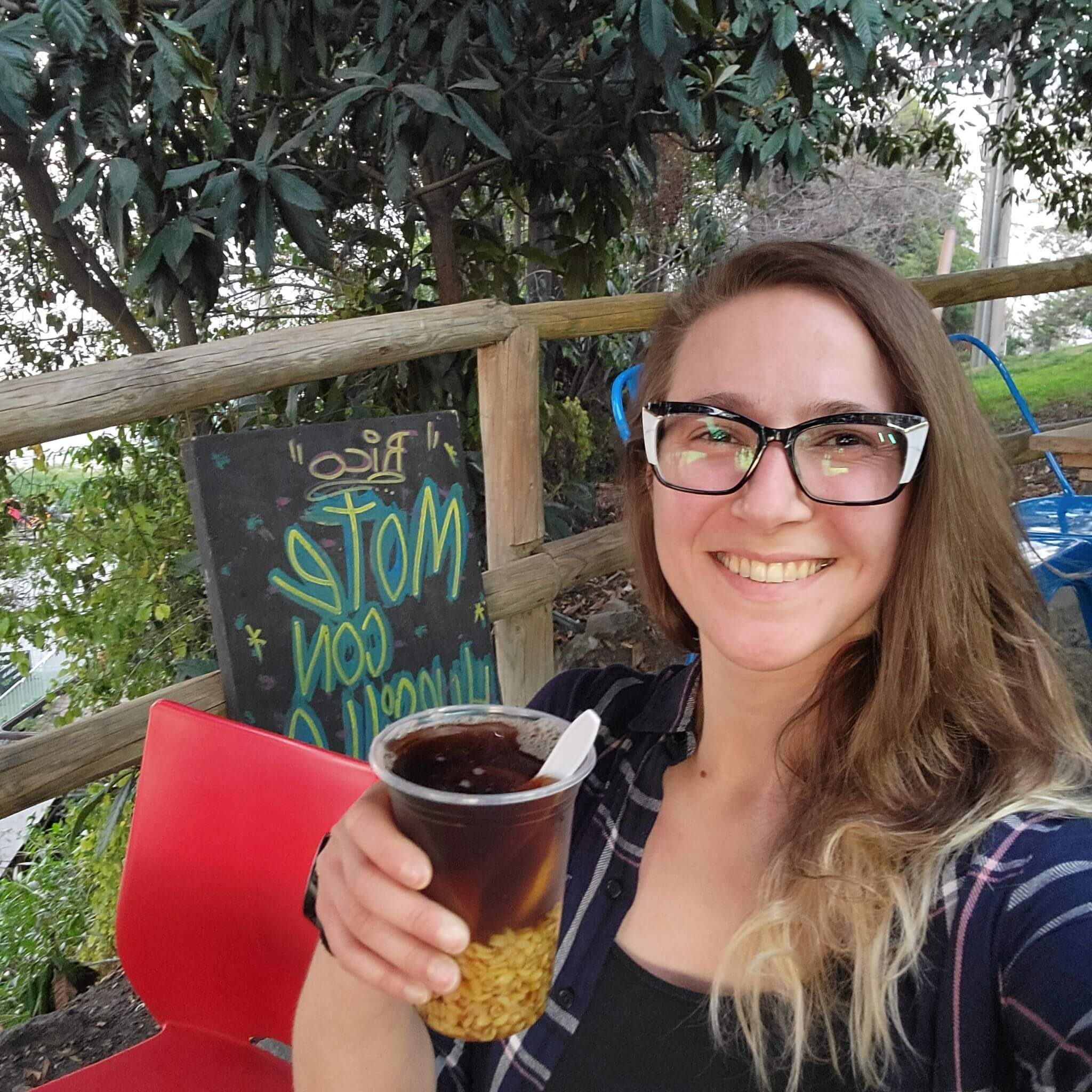 Caroline takes a selfie while enjoying the classic Chilean “Mote con Huesillo” after a long hike