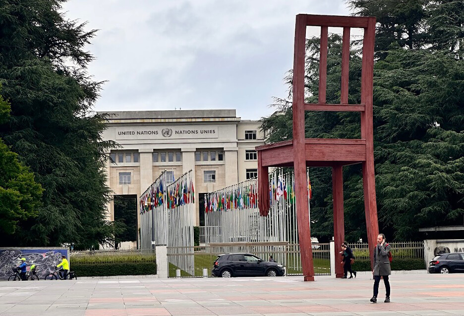 Shot of the front of the historic Palais des Nations with the iconic Broken Chair sculpture by Daniel Berset