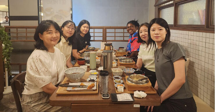 Micha having lunch with her team