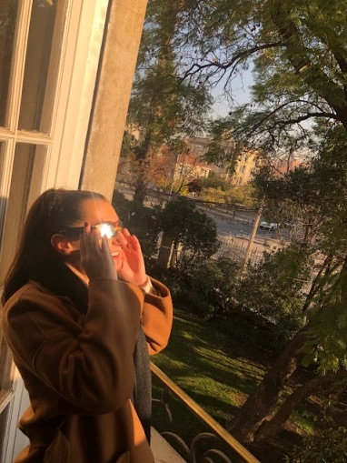 Maggie looks at eclipse with special glasses