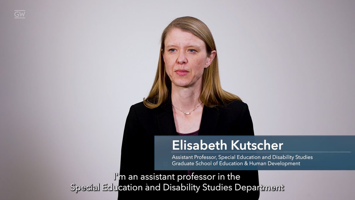 screenshot of a video featuring Elisabeth Kutscher sitting in front of a gray background. A blue bar is overlayed with her name and title "assistant professor, special education and disability studies, Graduate School of Education and Human Development"