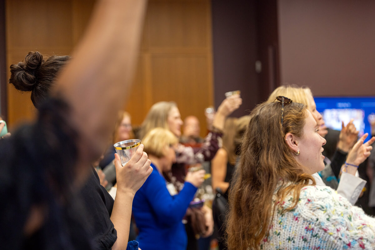 Guests raise their glasses for a cheers at MEP 50th event