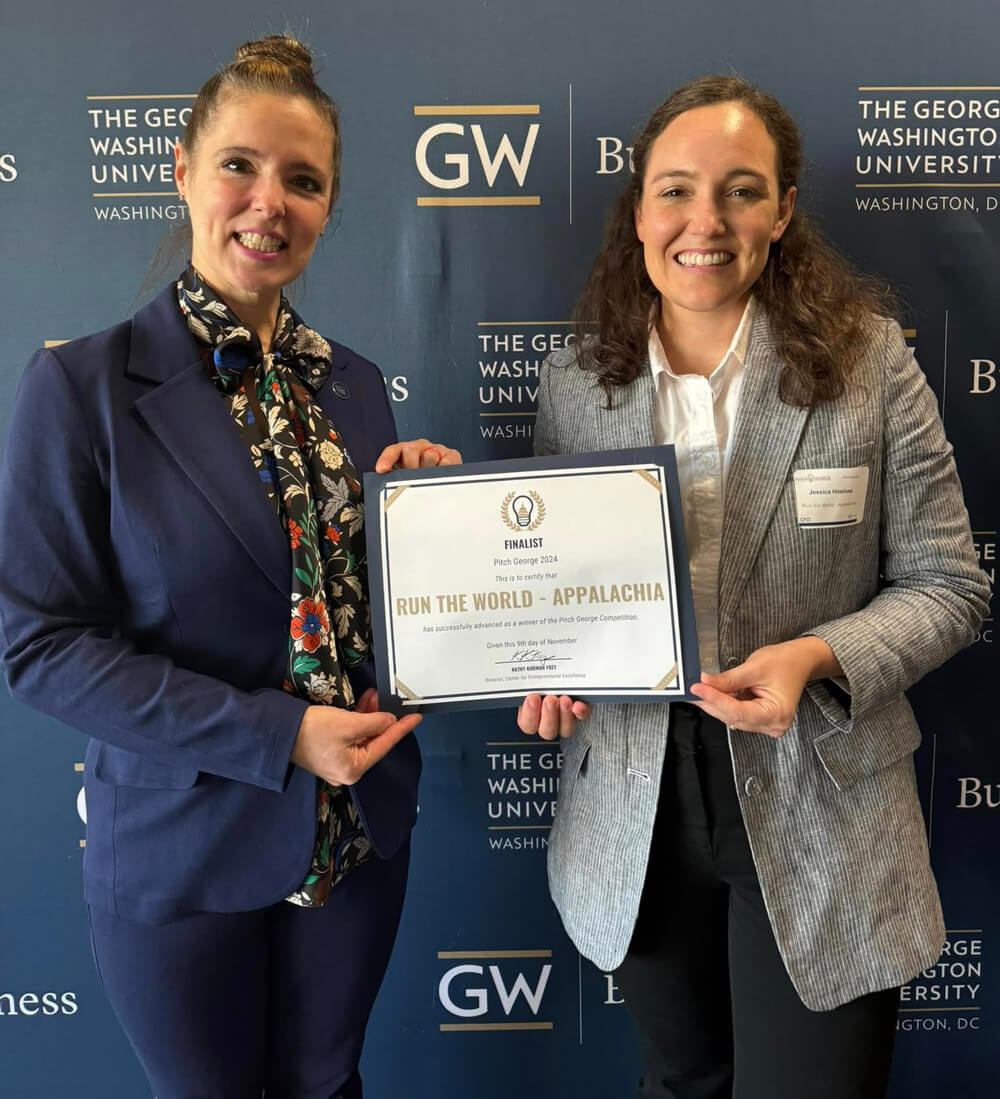 Rebecca Burns and Jessica Hinshaw pose for a photo holding their "Pitch George" finalist certificate