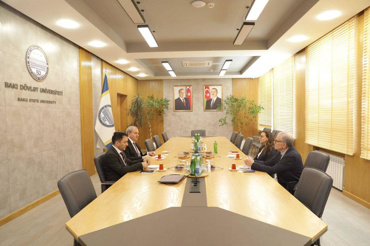 Dean Feuer, Sevinj Mammadova, Elchin Babayev, and Asiman Ilyasov meet in a conference room