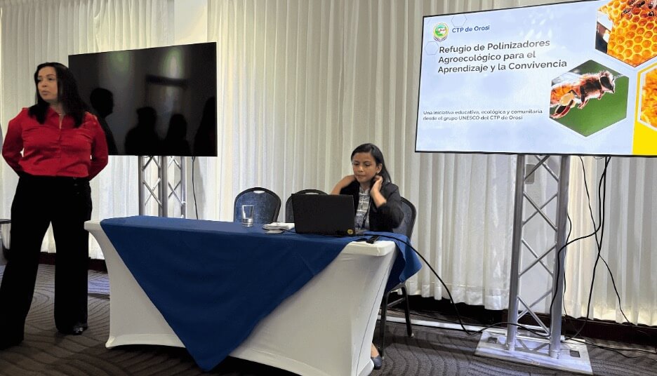 A representative from Orosi Technical School, a Cartago Regional School, presents project on "Pollinator Garden”
