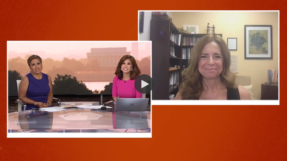 screenshot from live TV interview featuring the hosts in a window on the left and Dr. DeRaedt streaming from her office on the left