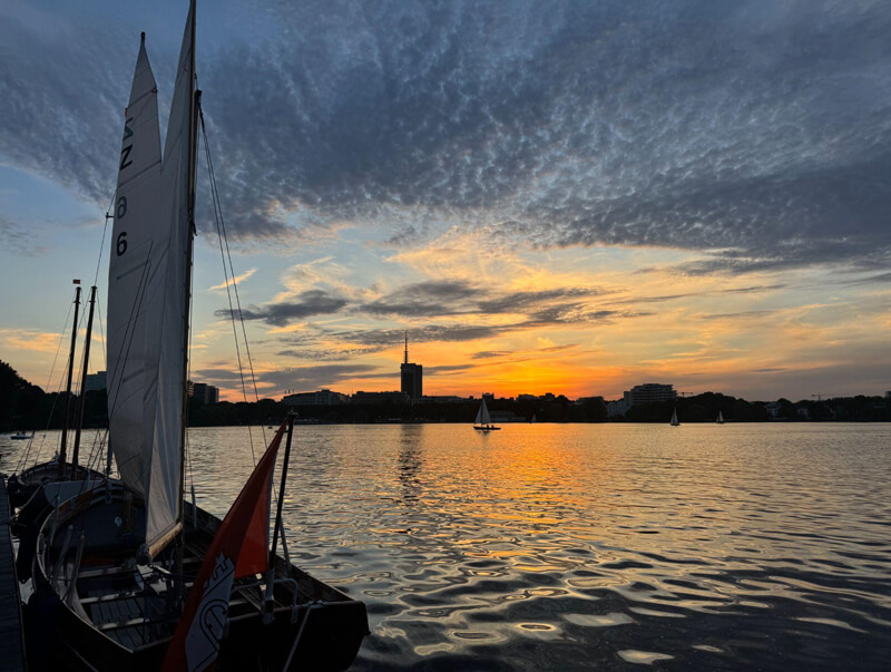 Sunset on a sailboat in Hamburg Alster