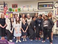 Principal Jamie Borg (far left) and Dr. Mary DeRaedt (far right) with GSEHD Elementary Ed Students