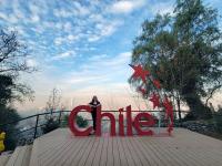 Caroline stands behind "Chile" sign in Metropolitan Park, Cerro San Cristobal