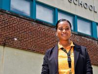 Cheronda Farrish headshot in front of Cedar Lane School
