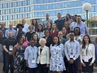 Partipants of the 2024 Fellowship and Summer Institute on Antisemitism & Jewish Inclusion pose for a group photo with Auschwitz survivor Irene Weiss