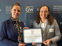 Rebecca Burns and Jessica Hinshaw pose for a photo holding their "Pitch George" finalist certificate