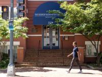 student walks toward GSEHD building