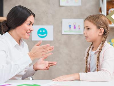 counselor works with elementary student - photo credit: Freepik