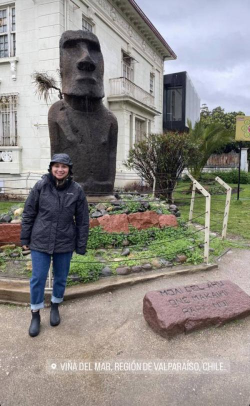 Stacy poses in front of one of few Moai statues located outside of Easter Island