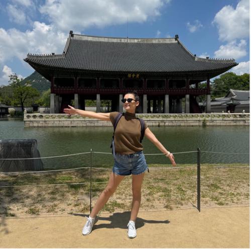 Tishkus poses in front of Gyeongbokgung Palace