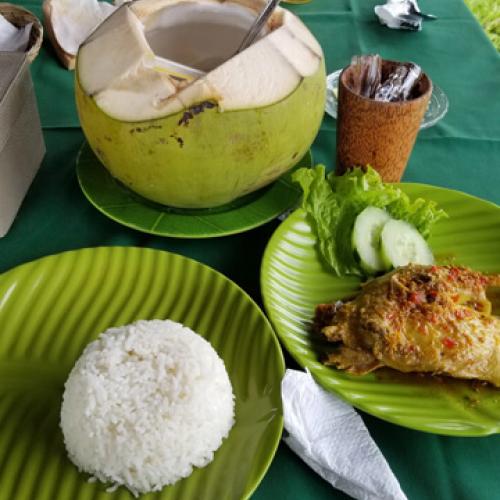 Balinese Food – Duck Betutu on green plates at restaurant