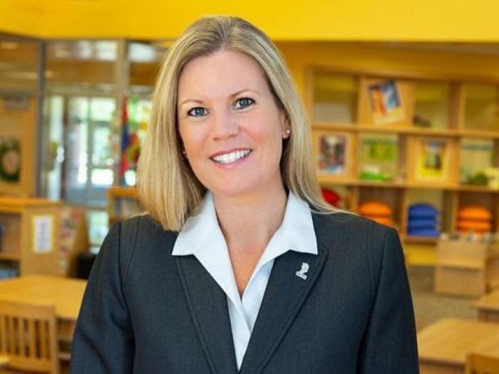 Dr. Amy Cashwell headshot taken in elementary library