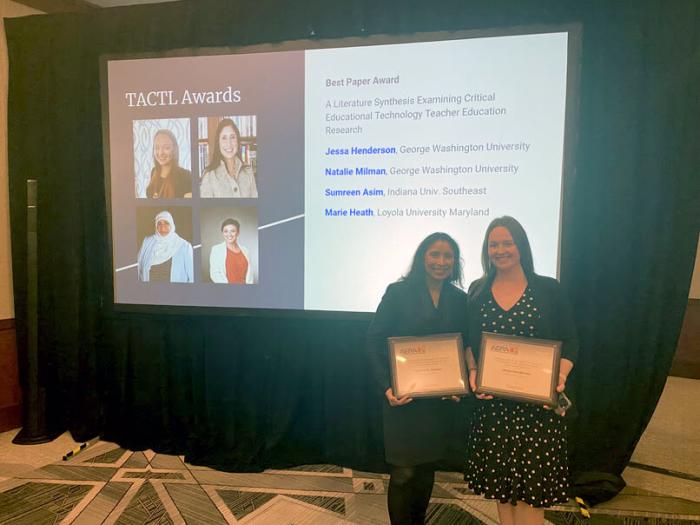 Dr. Milman and Henderson pose for photo after being presented with the TACTL Award at AERA conference