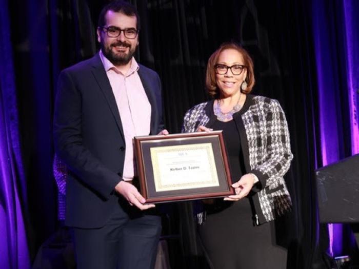 Kelber Tozini is presented with AIEA Award