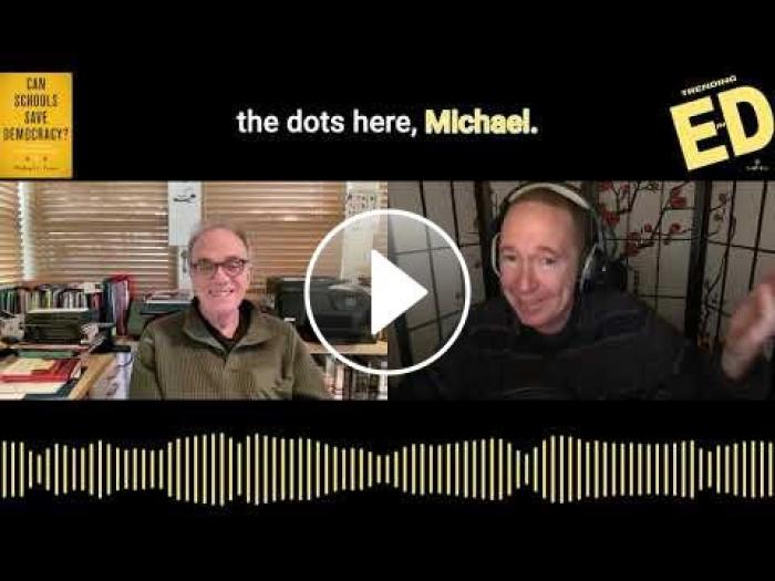 screenshot from taping of podcast via webcast, Dean Feuer on left, Mike Palmer wearing headphones on right; play button in the middle; cover of Feuer's book in top left corner, podcast logo in top right corner