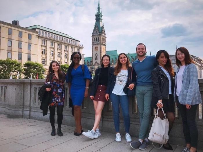 Kyle Hall photographed with colleagues in Hamburg
