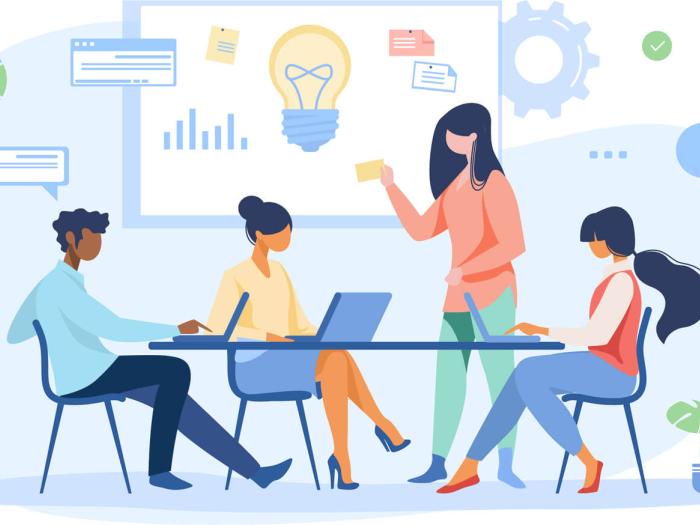 four professionals use technology to brainstorm and look at data