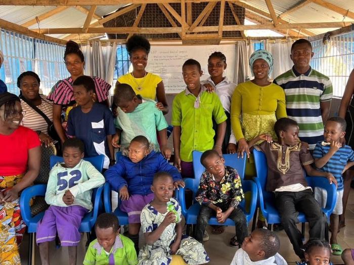 group photo of participants and their students at the International Inclusive Education Symposium