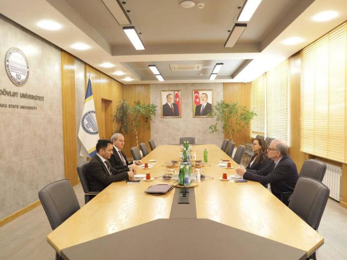 Dean Feuer, Sevinj Mammadova, Elchin Babayev, and Asiman Ilyasov meet in a conference room