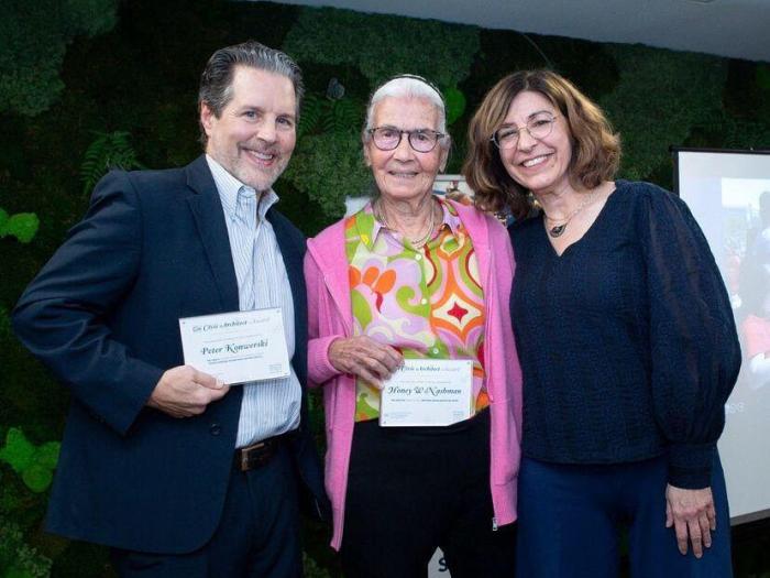 Peter Konwerski, Honey Nashman, and Amy Cohen pose for group photo with awards