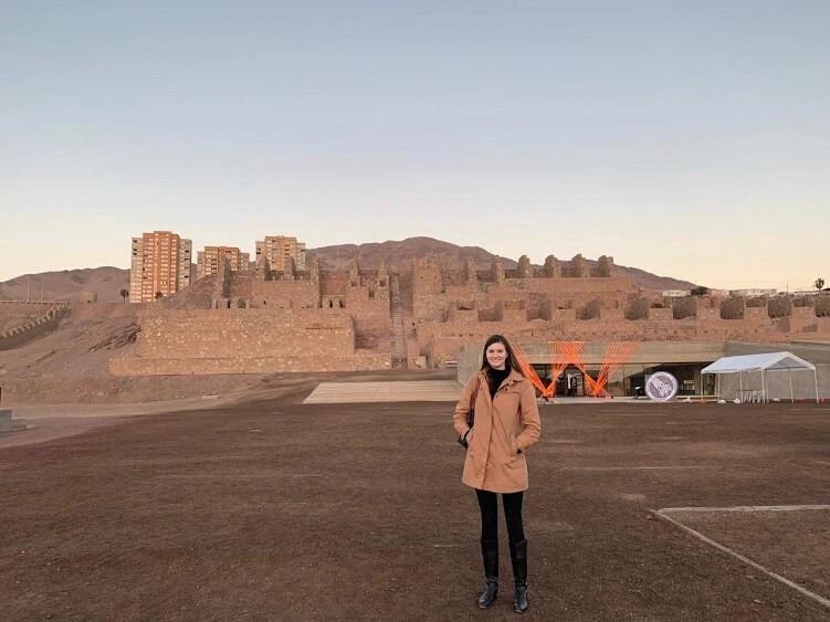 Maggie poses in front of Huanchaca Ruins Museum