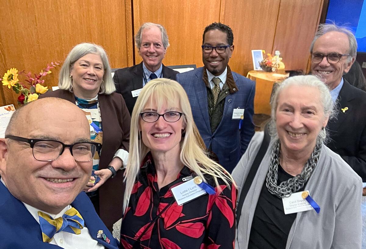 President Grandberg, Provost Bracey, Dean Feuer, Lotte Lent and featured speakers pose for a photo at Museum Program's 50th anniversary celebration