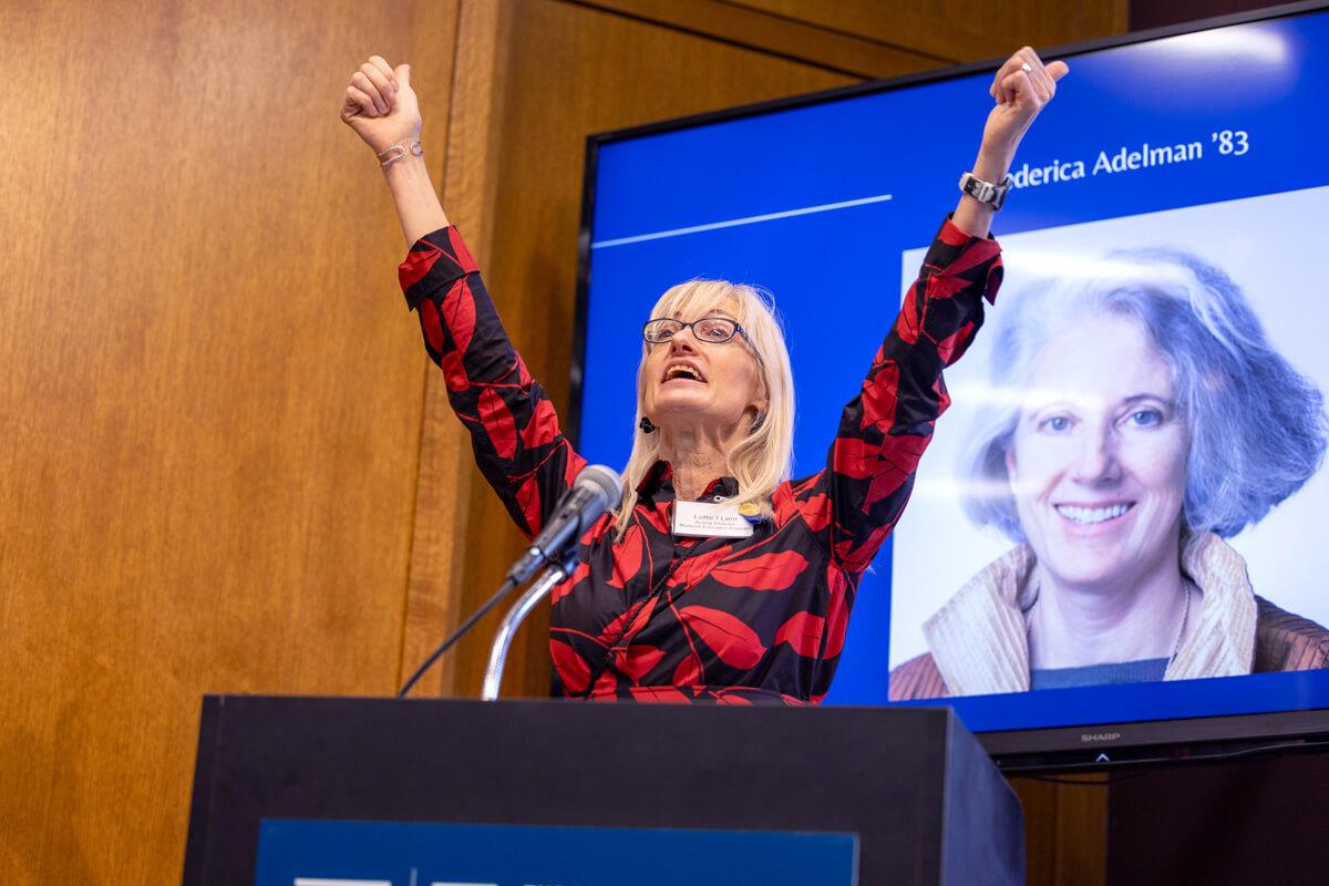 Lotte Lent raises her hands in the air in celebration at MEP 50th event