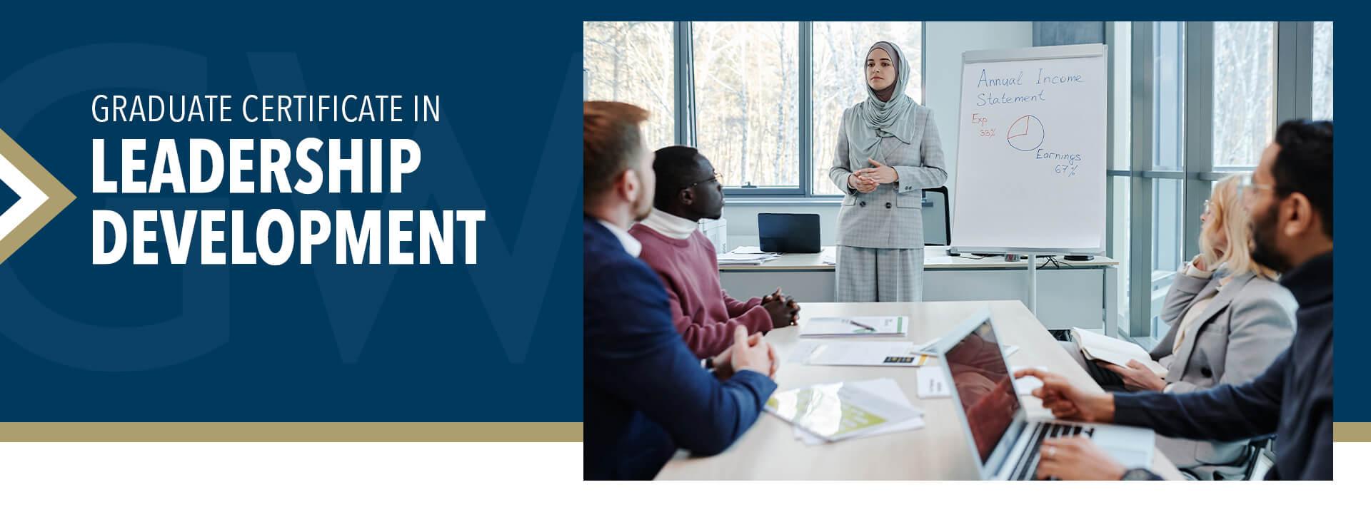 Graduate Certificate in Leadership Development  (image of professional female presenting information on a white board to a group of colleagues seated at conference table)