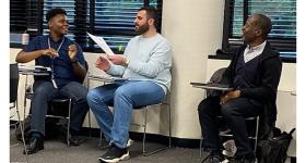 Dex Burns (left) and Mohanad Alsaid (right) in class with professor Ramien R. Pierre.