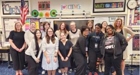 Principal Jamie Borg (far left) and Dr. Mary DeRaedt (far right) with GSEHD Elementary Ed Students