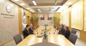 Dean Feuer, Sevinj Mammadova, Elchin Babayev, and Asiman Ilyasov meet in a conference room